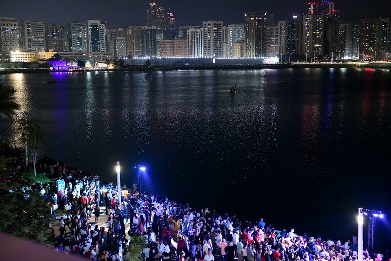 Spectators prepare to watch the fireworks display for UAE's 51st National Day on Al Maryah Island, Abu Dhabi. Khushnum Bhandari / The National
