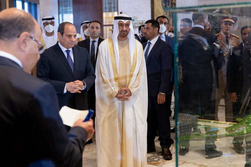 Sheikh Mohamed and Mr El Sisi look at the model of the Regal Heights Hotel.
