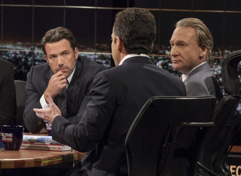 Host Bill Maher, right, and actor Ben Affleck, left, look on as Sam Harris, author of Waking Up: A Guide to Spirituality Without Religion, speaks during Real Time With Bill Maher, in Los Angeles. HBO / AP photo