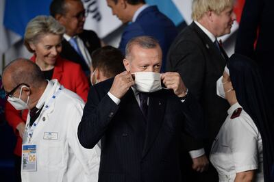 Turkish President Recep Tayyip Erdogan, seen here at the G20 in Rome, is under pressure to send Syrian refugees back. AFP