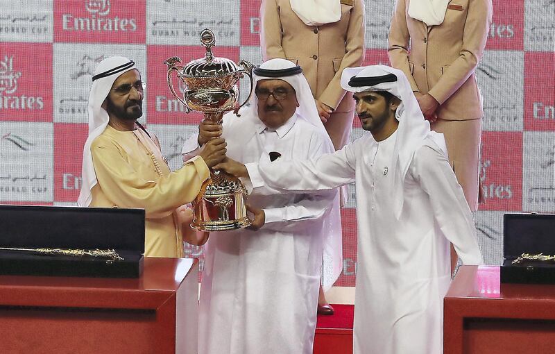 DUBAI , UNITED ARAB EMIRATES , MARCH 30  – 2018 :- Left to Right- Sheikh Mohammed bin Rashid Al Maktoum , Vice President and Prime Minister of the United Arab Emirates, and Ruler of the Emirate of Dubai ,  Sheikh Hamdan bin Rashid Al Maktoum, Deputy Ruler of Dubai and the Minister of Finance and Industry of the UAE and Sheikh Hamdan bin Mohammed bin Rashid Al Maktoum  Crown Prince of Dubai, United Arab Emirates during the trophy presentation ceremony after Thunder Snow ( IRE  ) ridden by Christophe Soumillon ( no  12 ) won the 9th horse race Dubai World Cup 2000m dirt during the Dubai World Cup held at Meydan Racecourse in Dubai. ( Pawan Singh / The National ) For News/Sports/Instagram/Big Picture. Story by Amith/Rupert