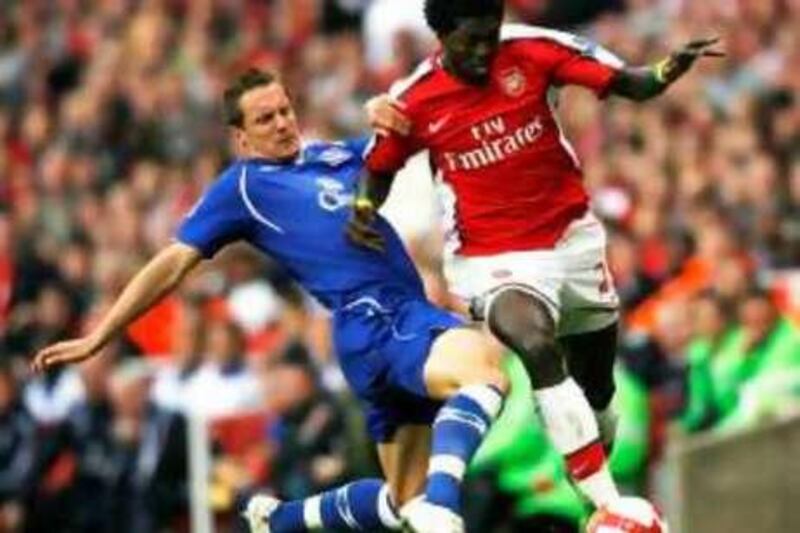 Arsenal's Togolese Striker Emmanuel Adebayor (R) vies with Everton's English Defender Phil Jagielka (L) during their Premier League match against Everton at the Emirates Stadium, London, on October 18, 2008. AFP PHOTO / Glyn Kirk

Mobile and website use of domestic English football pictures are subject to obtaining a Photographic End User Licence from Football DataCo Ltd Tel : +44 (0) 207 864 9121 or e-mail accreditations@football-dataco.com - applies to Premier and Football League matches *** Local Caption ***  512563-01-08.jpg