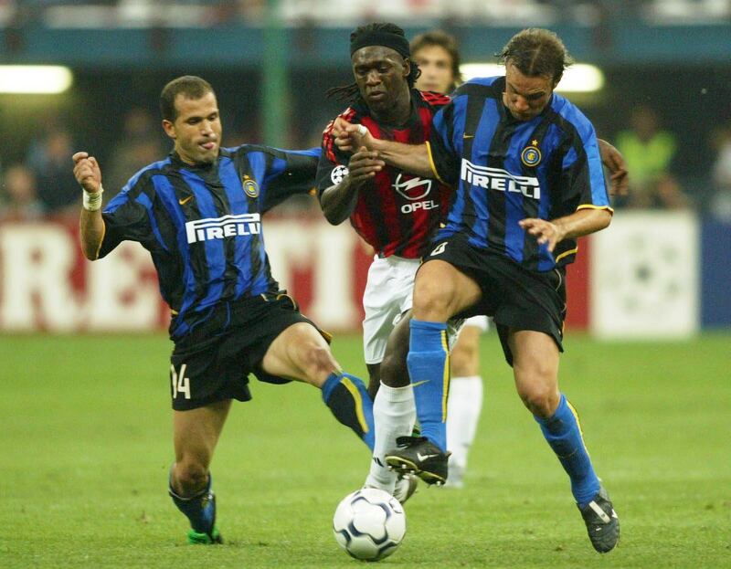 AC Milan's Clarence Seedorf is challenged by Luigi Di Biagio and Cristiano Zanetti in the second leg. Getty