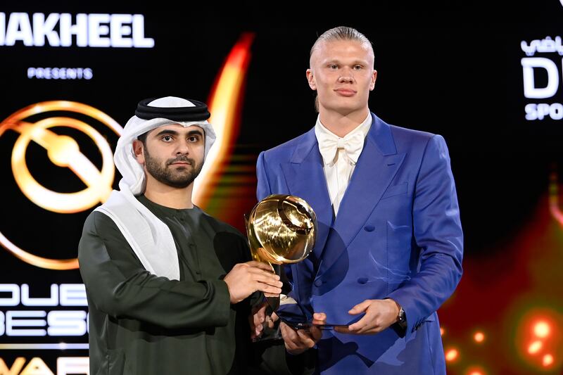 Erling Haaland with the Best Men's Player trophy at the Dubai Globe Soccer Awards ceremony on January  19, 2024. AP
