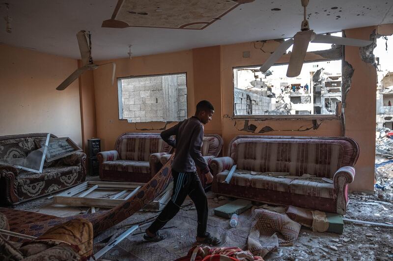 Palestinians inspect the rubble of their destroyed houses after a ceasefire between Israel and Gaza fighters, in Beit Hanun, northern Gaza Strip in Gaza City, Gaza. The ceasefire between Israel and Hamas appeared to be holding, despite fresh clashes at Al-Aqsa Mosque in East Jerusalem. The ceasefire brings to an end eleven days of fighting which killed more than 250 Palestinians, many of them women and children, and 13 Israelis. The conflict began on May 10th after rising tensions in East Jerusalem and clashes at the Al Aqsa Mosque compound. Getty Images