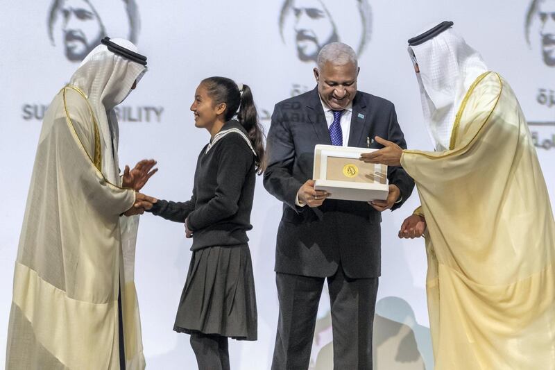 ABU DHABI, UNITED ARAB EMIRATES. 13 JANUARY 2020. The Zayed Sustainability Awards held at ADNEC as part of Abu Dhabi Sustainability Week. H.E. Sheikh Mohammed bin Zayed Al Nahyan, Crown Prince of Abu Dhabi and Deputy Supreme Commander of the United Arab Emirates Armed Forces awards Global High Schools Winner: South Asia, Bloom Nepal School, Nepal with the Prime Minister of Fiji, Frank Bainimarama. (Photo: Antonie Robertson/The National) Journalist: Kelly Clarker. Section: National.

