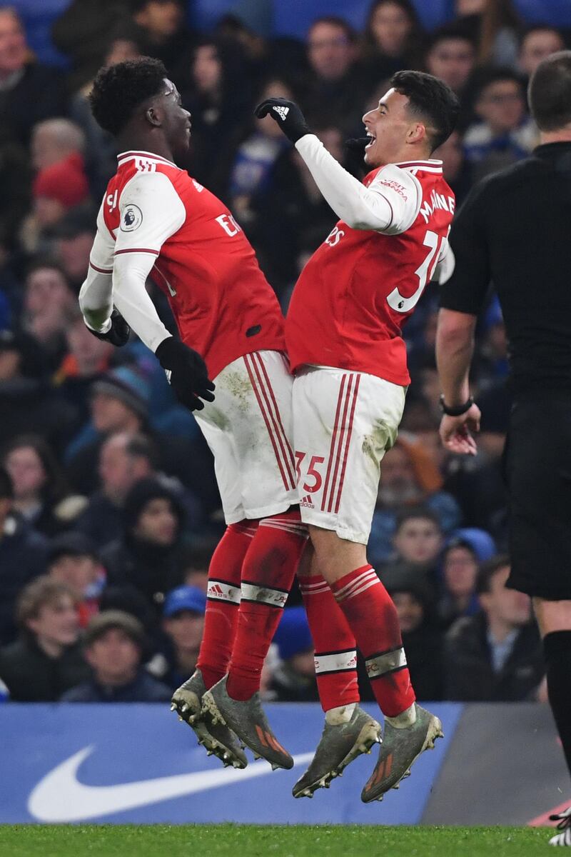 Arsenal's Brazilian striker Gabriel Martinelli (R) celebrates with Bukayo Saka after scoring the first equaliser. AFP