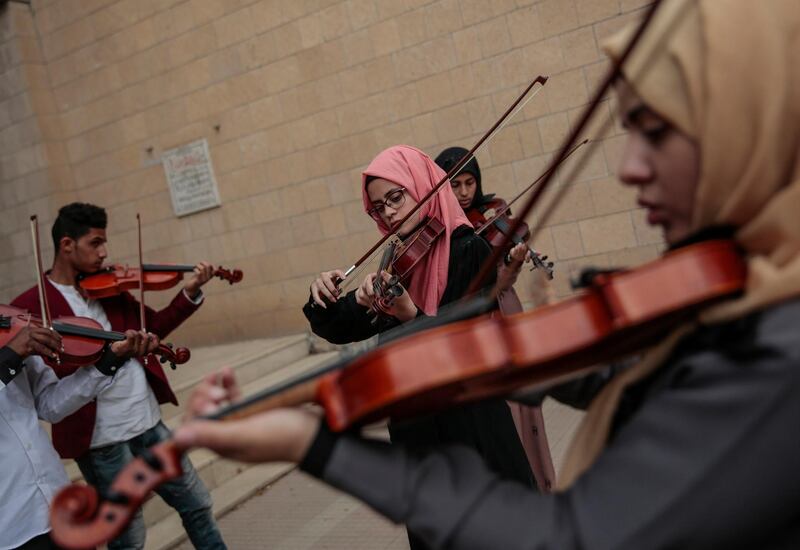 Yemeni music students play violins during a music class at the Cultural Centre in Sanaa, Yemen, on April 8, 2018. Hani Mohammed / AP Photo