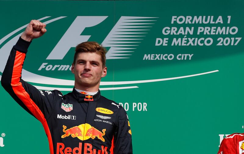 Red Bull driver Max Verstappen of the Netherlands celebrates on the podium after winning the Formula One Mexico Grand Prix auto race at the Hermanos Rodriguez racetrack in Mexico City, Sunday, Oct. 29, 2017. Lewis Hamilton won his fourth career Formula One season championship on Sunday with a ninth-place finish at the Mexican Grand Prix in a race won by Red Bull's Max Verstappen. (AP Photo/Moises Castillo)