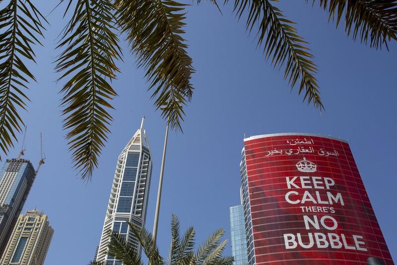 A giant advertising poster placed by Propertyfinder.ae. covers the side of the Shatha Tower in Dubai. Prices for prime property in the city rose faster than anywhere in the world during the first half of the year according to the broker Knight Frank. Landlords tried to take advantage of the rising prices by raising rents, which sparked an outbreak of disputes. Jason Alden / Bloomberg