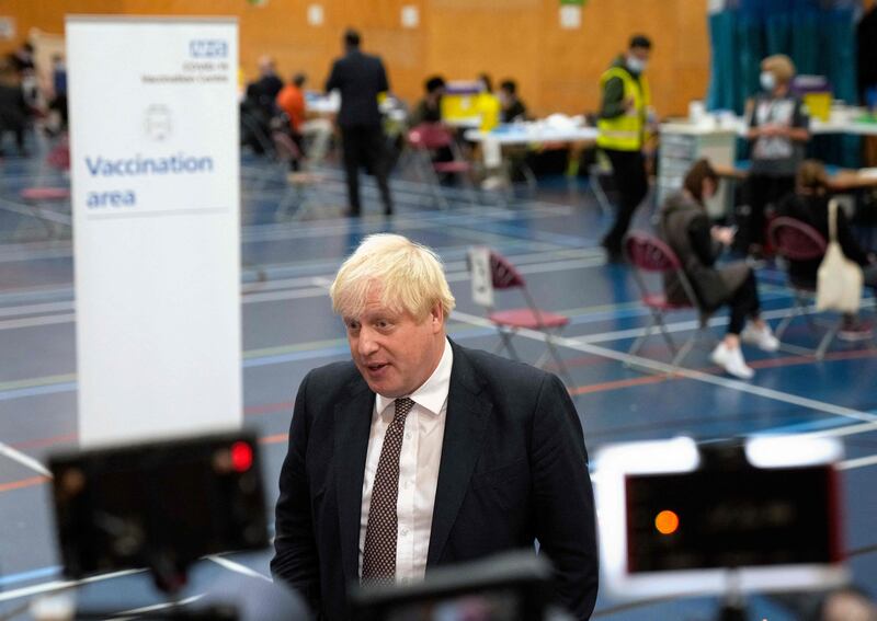 Britain's Prime Minister Boris Johnson speaks to the media as he visits a Covid-19 vaccination centre at Little Venice Sports Centre in London. AFP