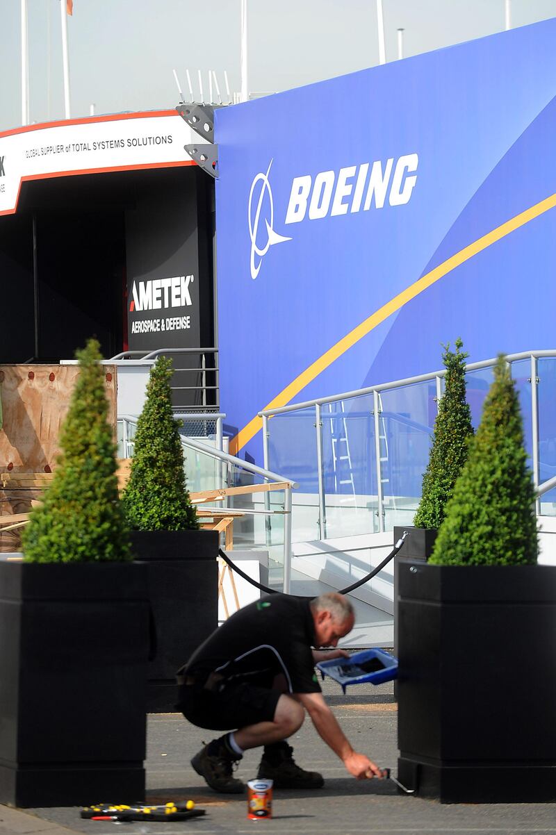 An employee works on a Boeing stand at the Paris International Air Show -- June 14, 2013 -- . (Antoine Antoine for The National) *** Local Caption ***  Paris Air Show003.JPG