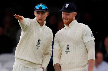 (FILES) In this file photo taken on August 16, 2019 England's captain Joe Root (L) and England's Ben Stokes talk between balls on the third day of the second Ashes cricket Test match between England and Australia at Lord's Cricket Ground in London. England coach Chris Silverwood is confident "talisman" Ben Stokes will lead from the front in Joe Root's absence during next week's first Test against the West Indies. - RESTRICTED TO EDITORIAL USE. NO ASSOCIATION WITH DIRECT COMPETITOR OF SPONSOR, PARTNER, OR SUPPLIER OF THE ECB / AFP / Adrian DENNIS / RESTRICTED TO EDITORIAL USE. NO ASSOCIATION WITH DIRECT COMPETITOR OF SPONSOR, PARTNER, OR SUPPLIER OF THE ECB