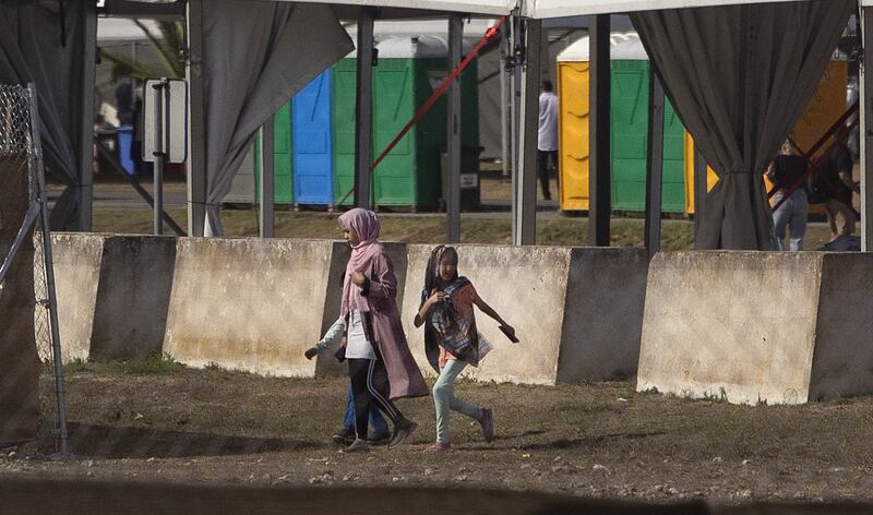 Afghans are seen at Rota naval base in Spain.  A temporary camp has been set up to host evacuees from Afghanistan with 53 tents with capacity for almost 1,600 people, although it is expected to be enlarged to host up to 3,000 people. EPA