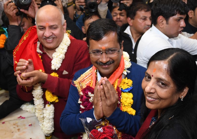 epa08211259 Aam Aadmi Party (AAP) chief and Chief Minister of Delhi Arvind Kejriwal (C), his wife Sunita Kejriwal (R-front) and Deputy Chief Minister of Delhi, Manish Sisodia (L), visit Hanuman Mandir temple to pay obeisance after AAP won the Delhi Assembly elections, New Delhi, India, 11 February 2020. AAP is set to form the government for the second term in Delhi after the current trends shows it is set for the majority of seats.  EPA/STR