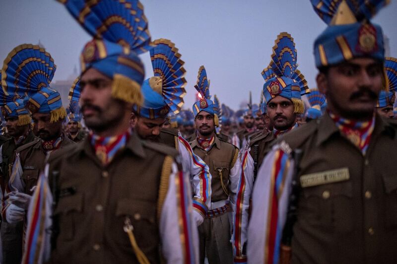 Soldiers take part in the rehearsal for the Republic Day parade early morning in New Delhi, India.  Reuters