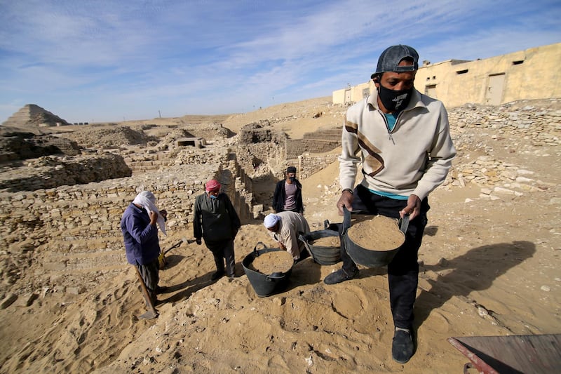 Men work at the site of a recent discovery at the Saqqara necropolis south of Cairo, Egypt. Reuters