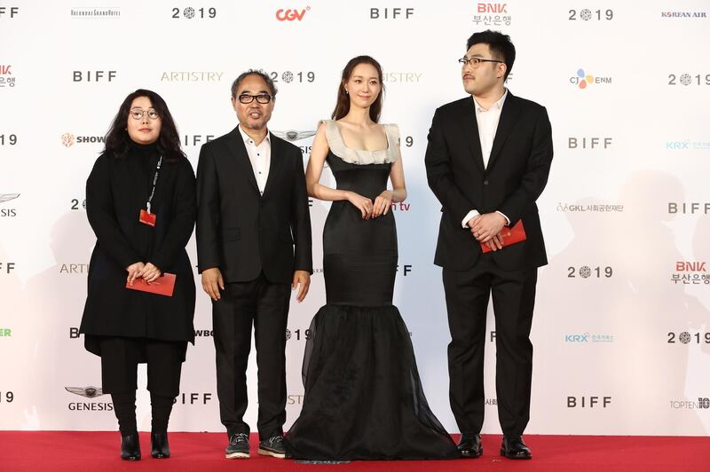 Actress Yoo Young and actor Kang Shin-il arrive for the Opening Ceremony of the 24th Busan International Film Festival. Getty Images