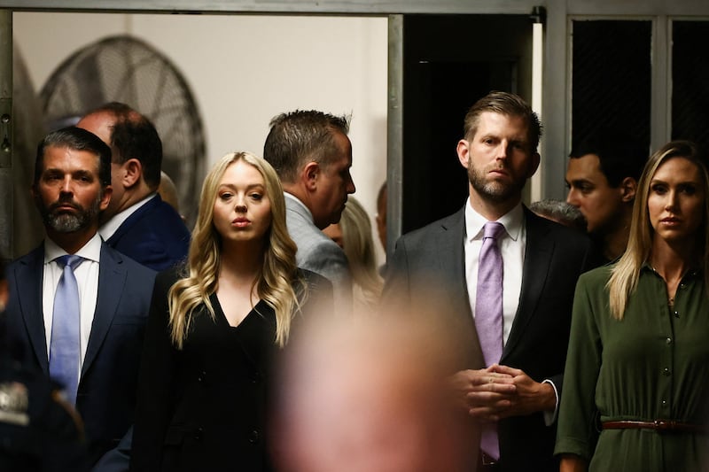Eric Trump, Donald Trump Jr and the former president's daughter-in-law, Lara Trump, arrive at the court. Reuters