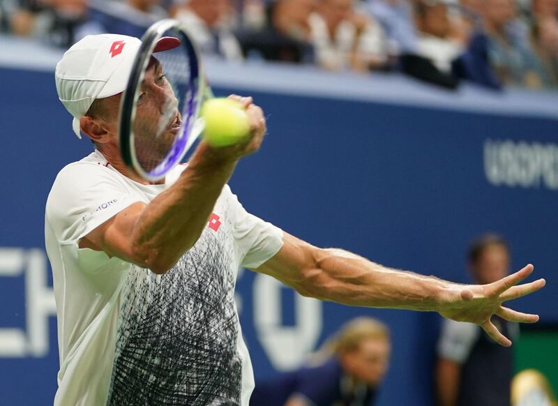 Millman hits a return to Djokovic. AFP