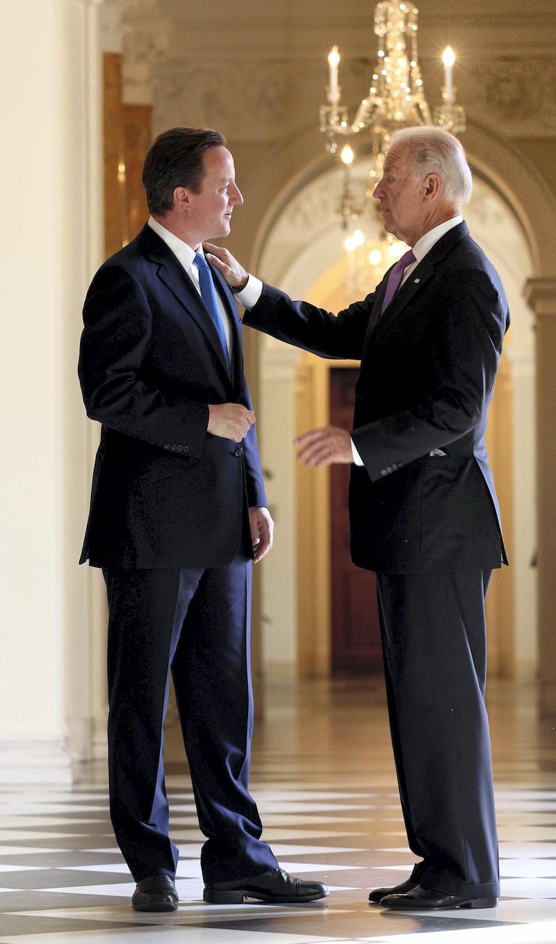 WASHINGTON - JULY 20: British Prime Minister David Cameron (L) greets Joe Biden, the Vice President of the United States of America, at the UK ambassador's residence on July 20, 2010 in Washington, DC. Mr Cameron is embarking on a two-day visit to America, he will meet with President Obama later today where the leaders are expected to discuss the military situation in Afghanistan and BP's oil spill in the Gulf of Mexico.   Oli Scarff/Getty Images/AFP