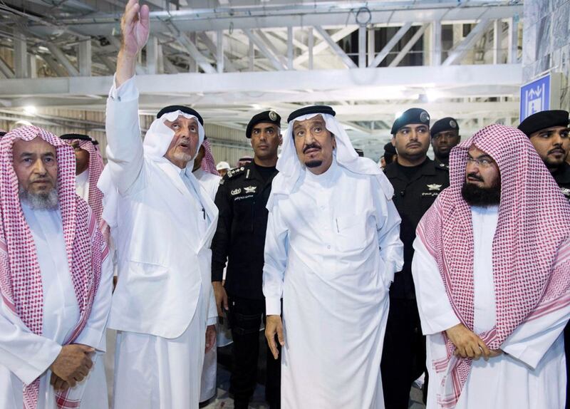 Saudi Arabia’s King Salman and Mecca governor Khaled Al Faisal visit the site of the crane carsh at Grand Mosque on Saturday. AFP