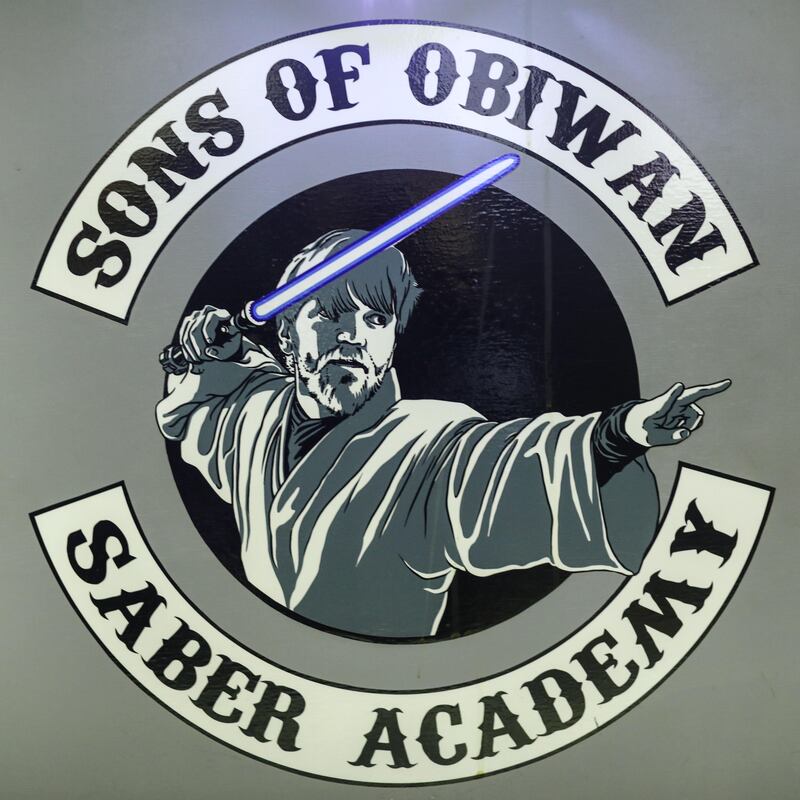 The Sons of Obiwan Saber Academy company logo.