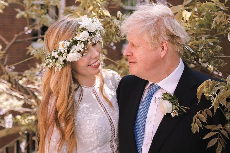May 2021: Boris Johnson poses with his wife Carrie Johnson in the garden of No 10 Downing Street after their secret wedding at Westminster Cathedral.