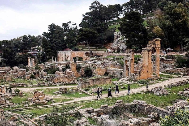 Visitors walk through the remains of the Sanctuary of Apollo in the ruins of Libya's ancient eastern city of Cyrene. Founded about 2,700  years ago, Cyrene was one of the principal cities in the Hellenic world, according to Unesco. AFP