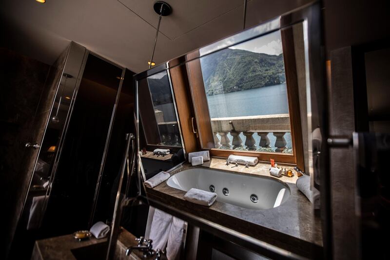 A bathtub overlooking the lake, reflected on a bathroom mirror of the historical Grand Hotel Tremezzo, in Tremezzo, on Como Lake, Italy. The hotel was built in 1901. AP Photo / Luca Bruno