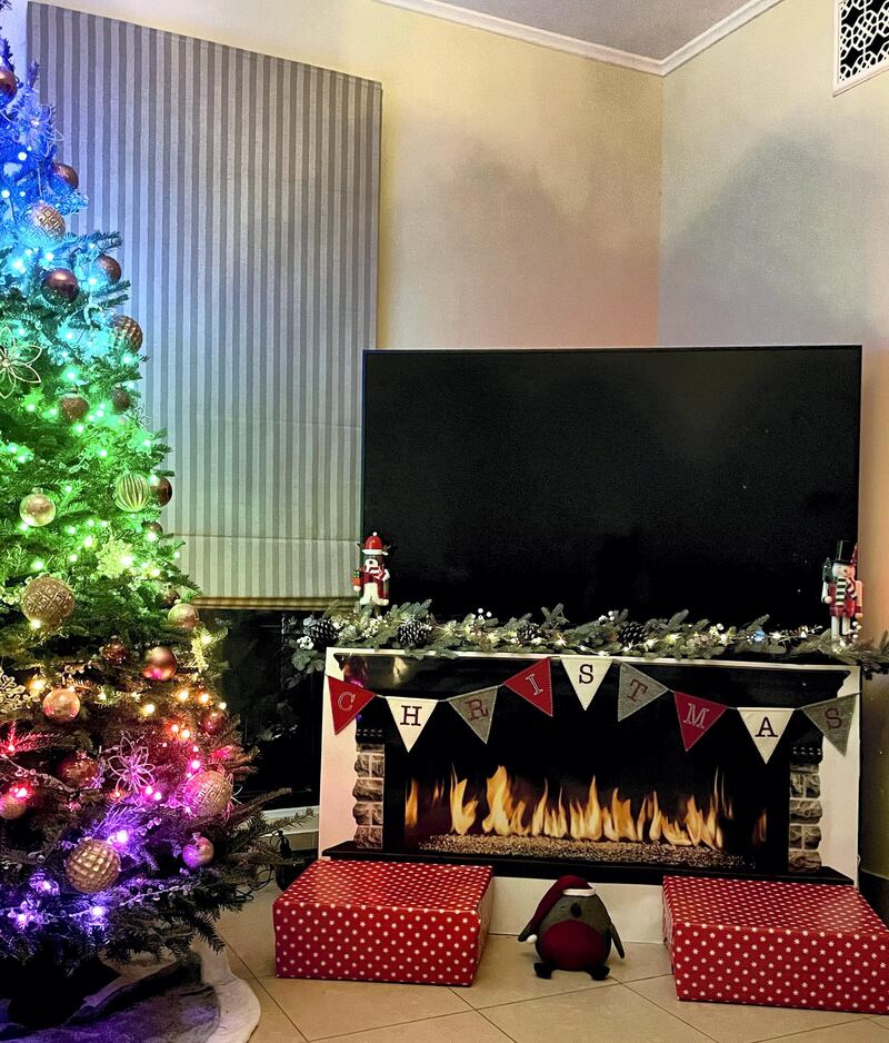 The Trafford family from Downtown Dubai printed a stock image and stuck it in front of the TV unit. 'We didn't have space for the traditional faux fireplace so we went with this instead,' says Natalie Trafford. Courtesy Natalie Trafford