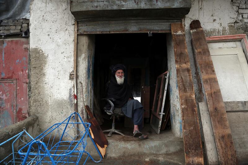 A carpenter waits for customers in Kabul, Afghanistan. AP Photo