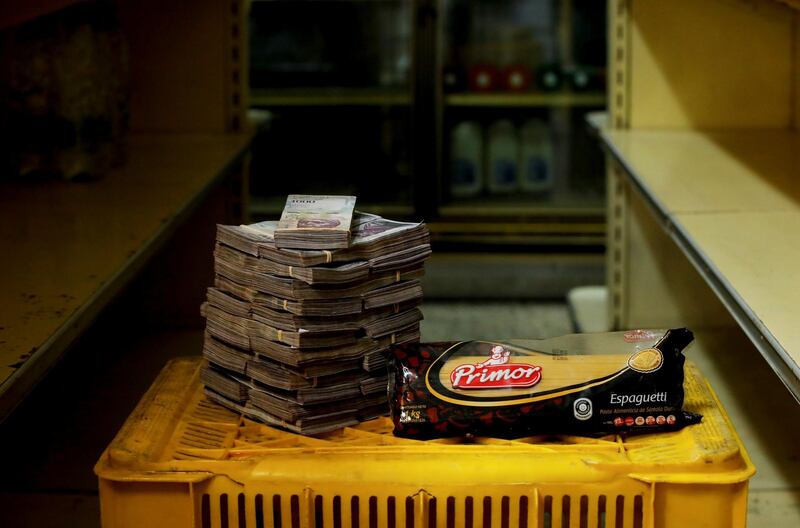 A packet of pasta is pictured next to 2,500,000 bolivars
