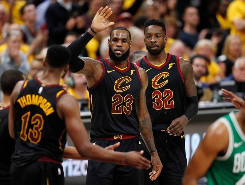 epa06754998 LeBron James (C) of the Cleveland Cavaliers celebrates with Cleveland Cavaliers center Tristan Thompson (L) of Canada as Cavaliers Jeff Green (R) looks on against the Boston Celtics during the second half of game four of the Eastern Conference Finals at Quicken Loans Arena in Cleveland, Ohio, USA, 21 May 2018.  EPA/DAVID MAXWELL  SHUTTERSTOCK OUT