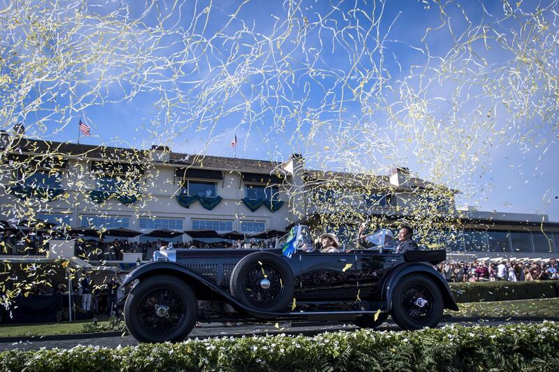 Confetti falls a 1931 Bentley 8 litre Gurney Nutting Sport Tourer. Bloomberg