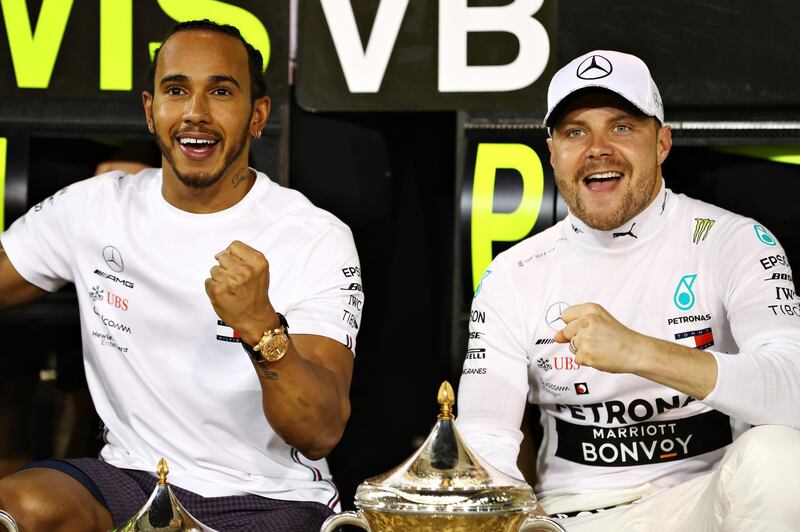 BAHRAIN, BAHRAIN - MARCH 31: Race winner Lewis Hamilton of Great Britain and Mercedes GP and second placed finisher Valtteri Bottas of Finland and Mercedes GP celebrate with their team after the F1 Grand Prix of Bahrain at Bahrain International Circuit on March 31, 2019 in Bahrain, Bahrain. (Photo by Mark Thompson/Getty Images)