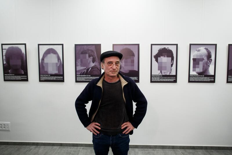 MADRID, SPAIN - FEBRUARY 26:  Spanish artist Santiago Sierra poses for press as he presents a reproduction of his work 'Political prisoners of contemporary Spain' at Anselmo Lorenzo Libertarian Studies Foundation after it was removed from ARCO art fair last week on February 26, 2018 in Madrid, Spain. Last week IFEMA decided to remove Sierra's art-installation from a major contemporary art fair. His work depicts two jailed Catalan separatist leaders, among others allegedly political prisoners in Spain. The row comes in the same week that a rapper was sentenced to three and half years in prison for his lyrics and a judge ordered copies of 'Farina', a book about drug smuggling in Galicia to be seized, during a defamation suit brought by a former mayor in the region.  (Photo by Pablo Blazquez Dominguez/Getty Images)