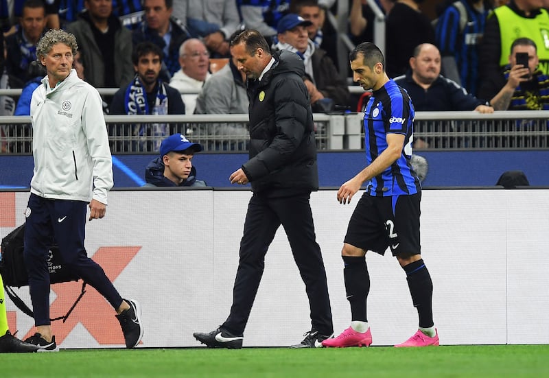 Inter Milan's Henrikh Mkhitaryan leaves the pitch after sustaining an injury. Reuters