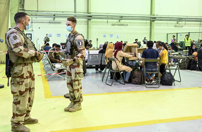 French soldiers and civilians at the airbase in Al Dhafra. AFP