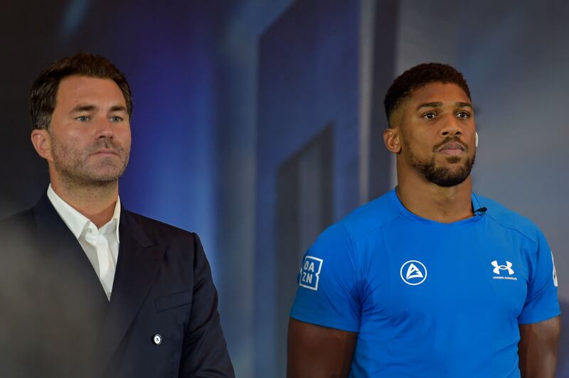 Chairman of Matchroom Sport Eddie Hearn and Anthony Joshua. AFP