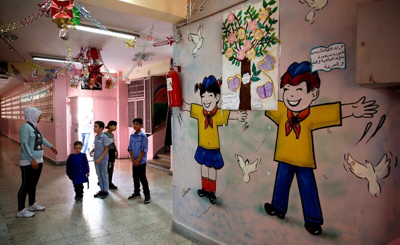 Syrian students gather at their school on the first day of the new academic year, in Damascus, Syria.  EPA