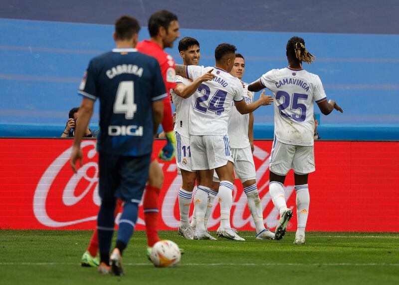 Marco Asensio celebrates scoring their third goal with Mariano Diaz, Eduardo Camavinga and teammates. Reuters