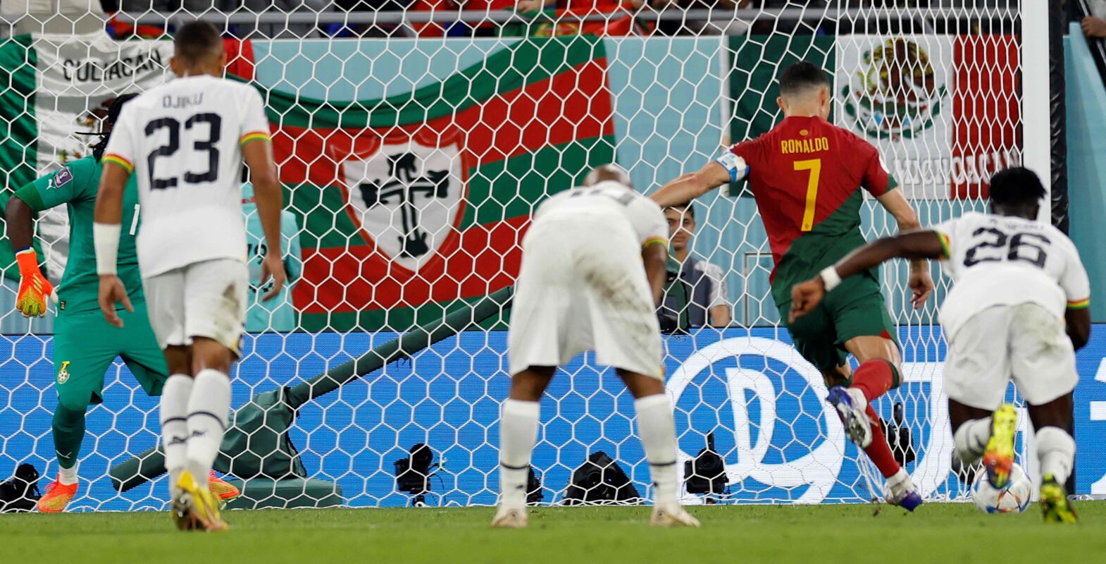 Portugal's forward #07 Cristiano Ronaldo (2nd R) scores his team's first goal from a penalty shot during the Qatar 2022 World Cup Group H football match between Portugal and Ghana at Stadium 974 in Doha on November 24, 2022.  (Photo by Khaled DESOUKI  /  AFP)