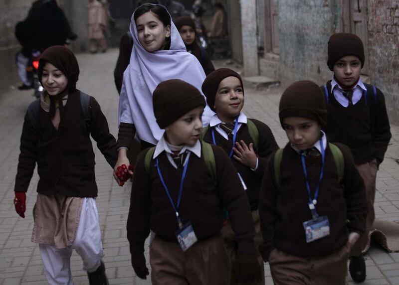 Pakistani school children leave the school.  Bilawal Arbab / EPA