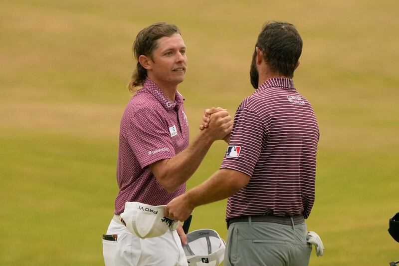 Cameron Smith shakes hands with Cameron Young after their final round of the Open. AP