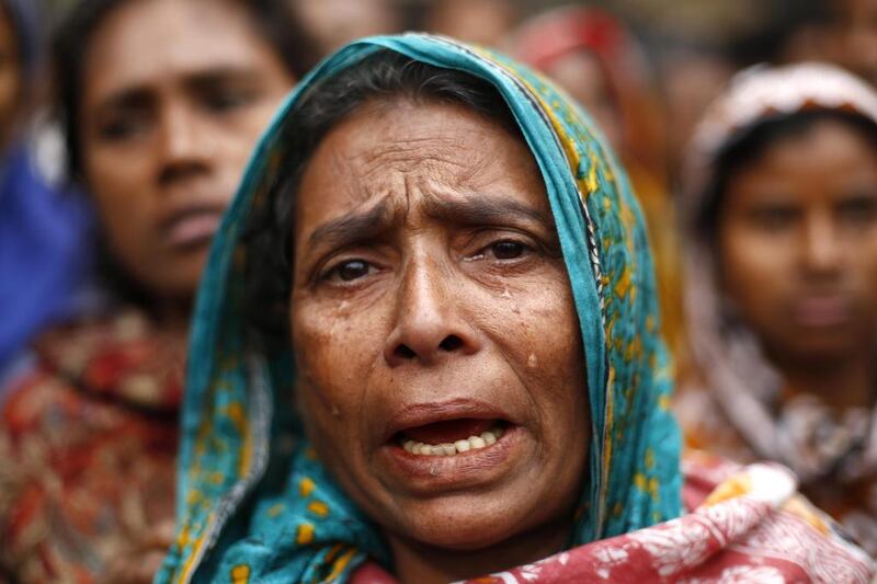 An evicted slum dweller cries and shouts slogans against authorities as they attend a protest rally during the celebration of the International Human Rights Day in Dhaka, Bangladesh. Abir Abdullah / EPA