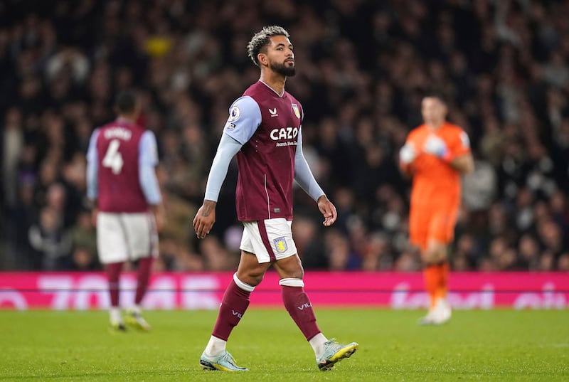 Aston Villa's Douglas Luiz walks off the pitch after being shown a red card by referee Michael Oliver. AP