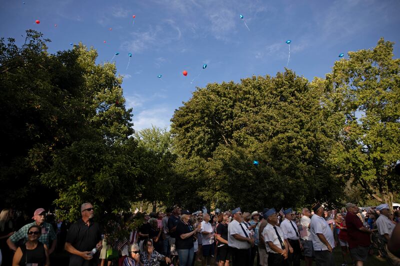 People release balloons at a vigil for Soviak. Reuters