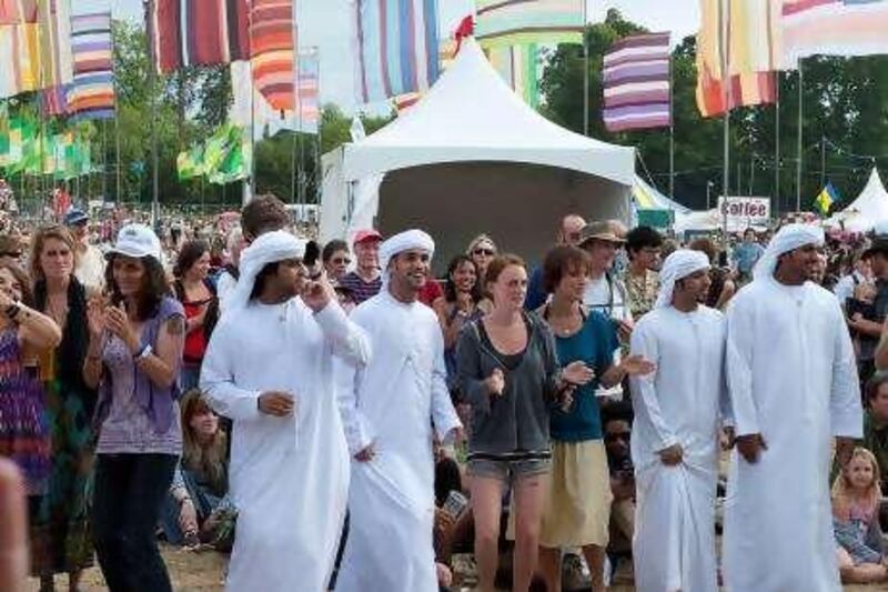 Members of the 14 piece Abu Dhabi Folk Dance Group dance with the  
crowd at WOMAD UK, July 24th 2010. The group gave their first  
international performance at the festival at Charlton Park, Wiltshire,  
England.

Courtesy: Adach.