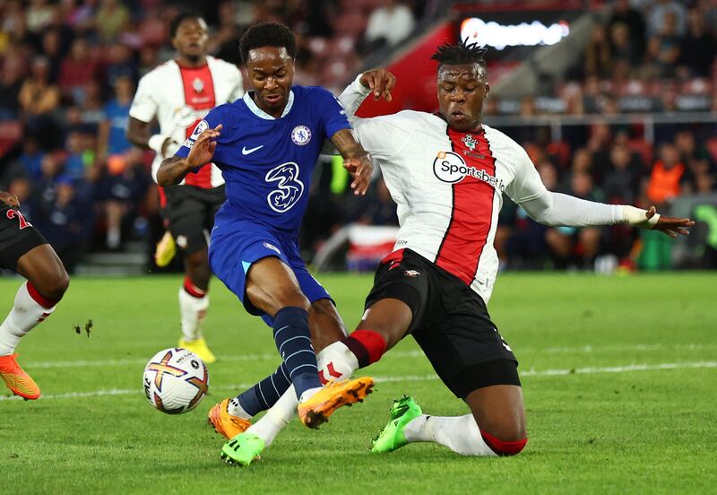 Soccer Football - Premier League - Southampton v Chelsea - St Mary's Stadium, Southampton, Britain - August 30, 2022 Chelsea's Raheem Sterling in action with Southampton's Armel Bella-Kotchap REUTERS/David Klein EDITORIAL USE ONLY.  No use with unauthorized audio, video, data, fixture lists, club/league logos or 'live' services.  Online in-match use limited to 75 images, no video emulation.  No use in betting, games or single club /league/player publications.   Please contact your account representative for further details. 